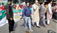 আওয়ামী লীগের মিছিলে প্রকাশ্যে অস্ত্র হাতে কে এই ব্যক্তি!